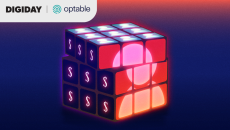 Animated Rubik’s cube showing dollar signs and a user icon, symbolizing audience data monetization and identity solutions in digital publishing.